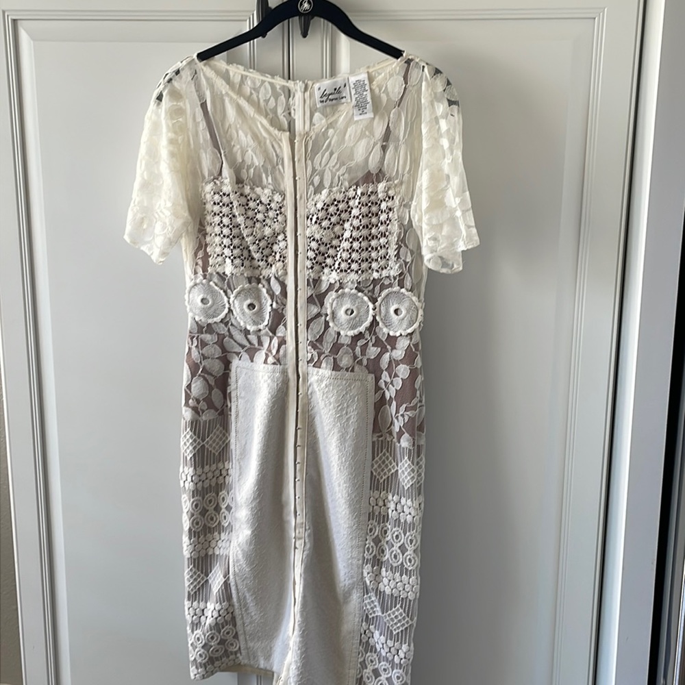 Byron Mars Ivory lace with nude lining . Perfect for this summer
